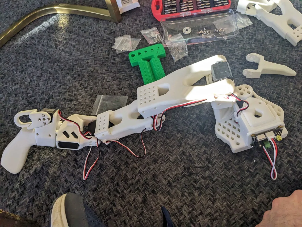 The finished leader and follower arms lying side by side