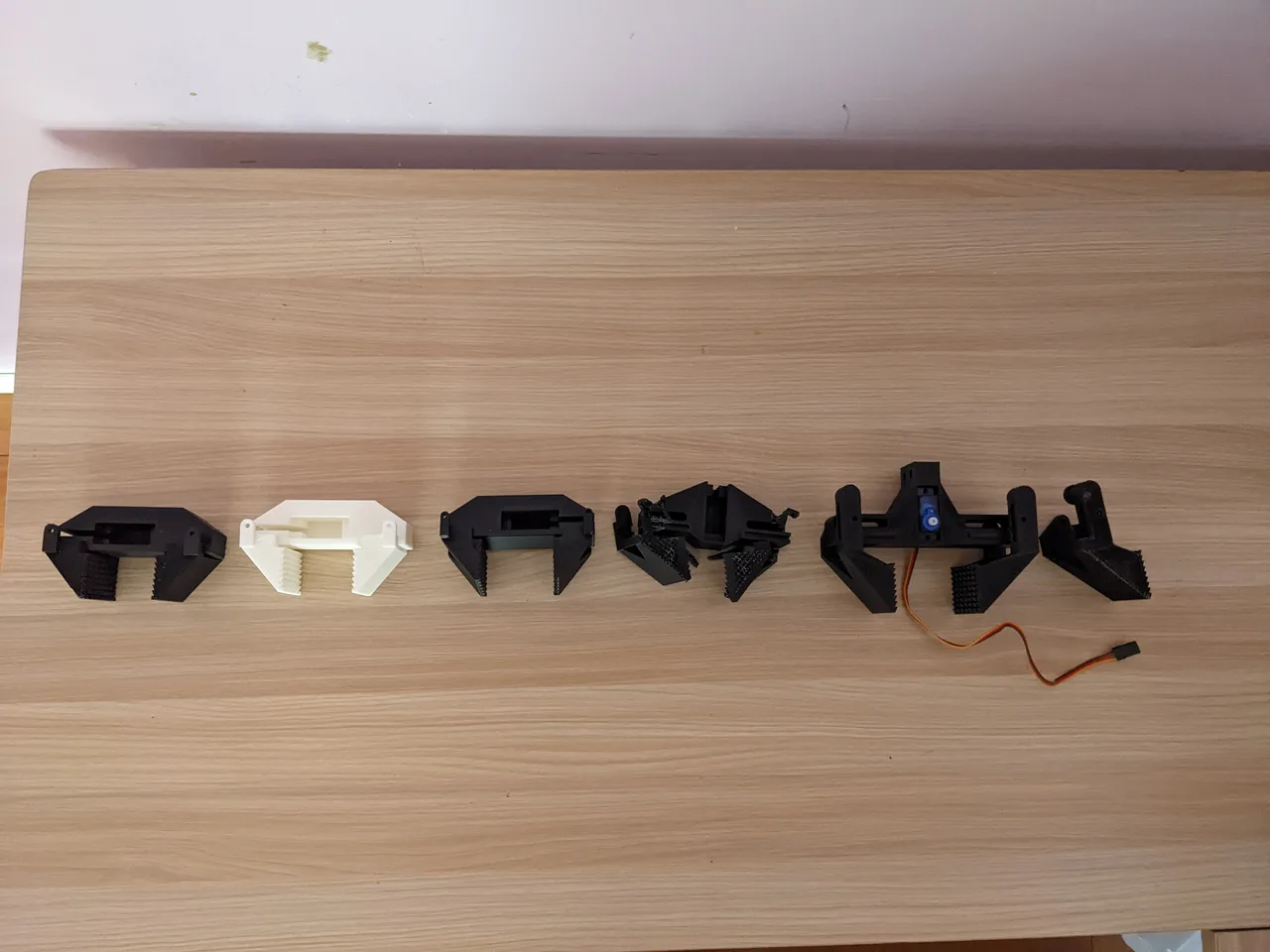 A closer view of the gripper lineup and servo wiring