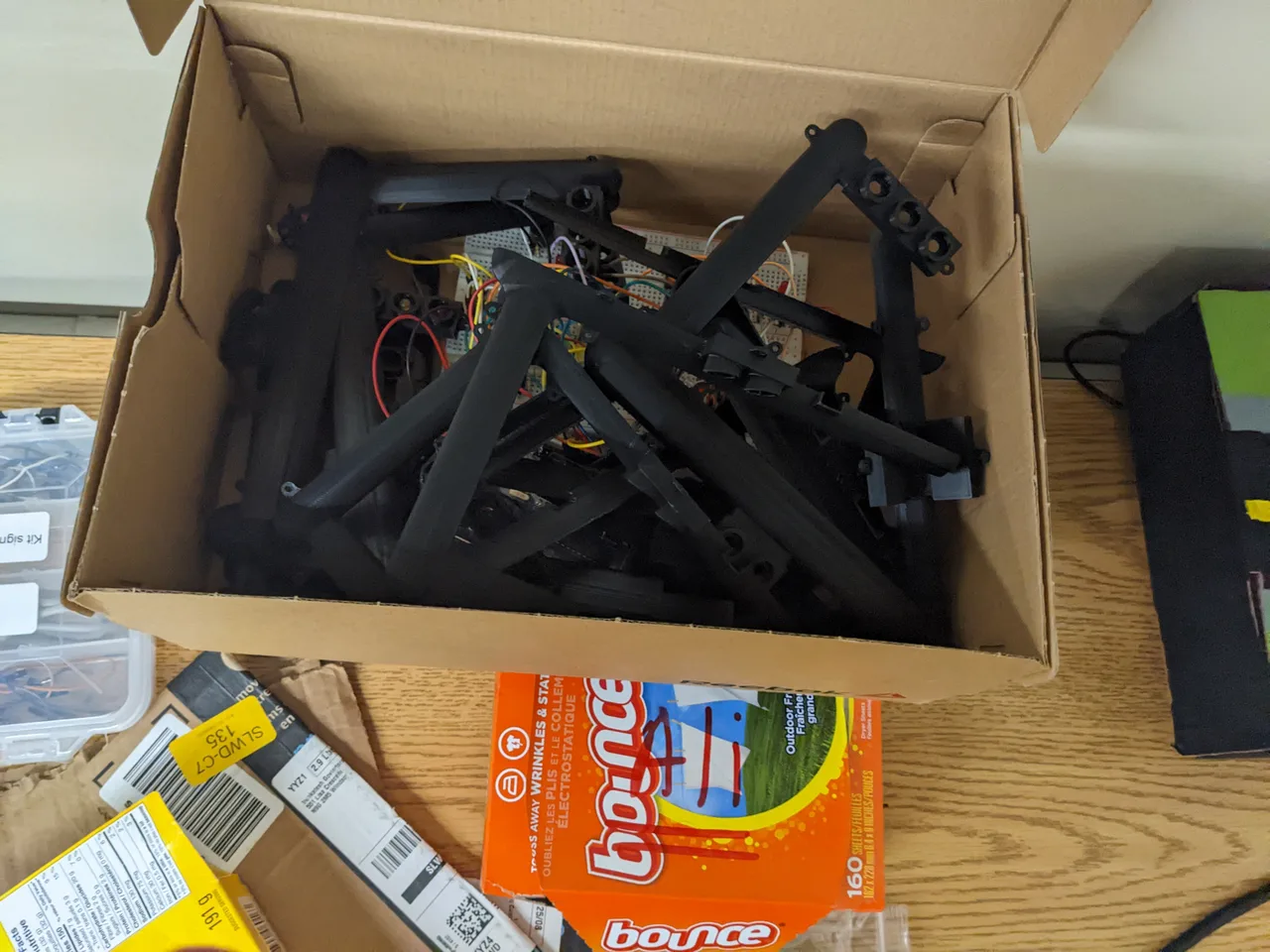 Black printed traffic-light supports and housings packed in a cardboard box