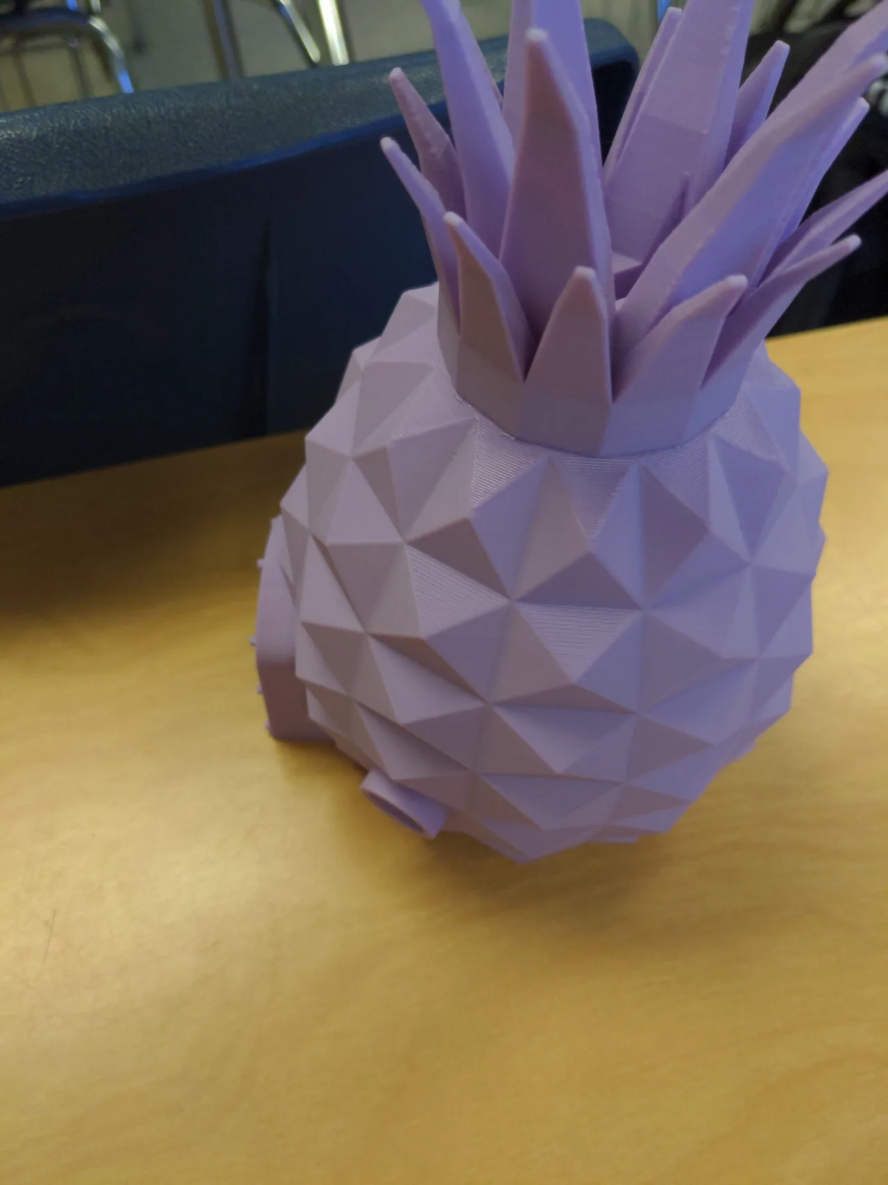 Close-up of the purple printed pineapple body and its faceted surface