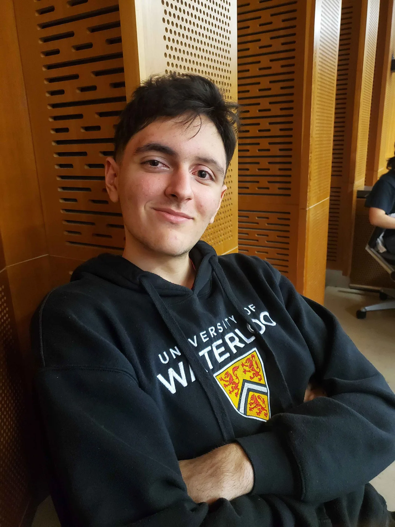 Team member seated in an auditorium